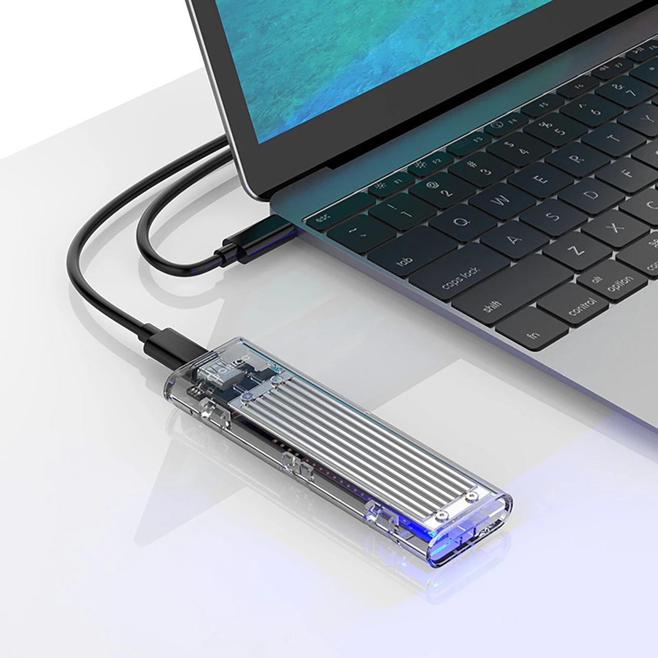 Ohišje za SSD M.2 NVMe Orico TCM2-C3, USB-C 10Gb/s, sivo/prosojno